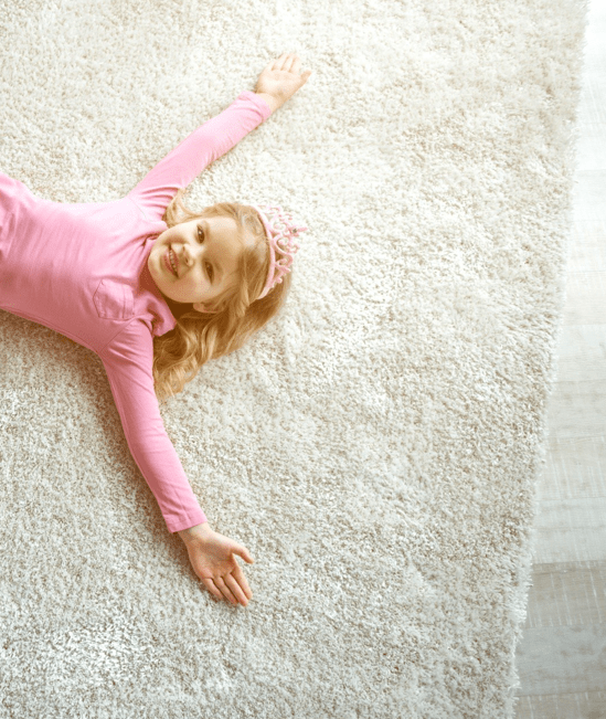 Cute girl laying on rug | Lake Interiors Chelan
